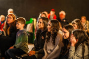 An image of a seated mum and daughter watching the bottle feeding show at Cantref Adventure Farm.
