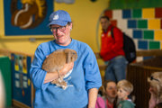 An image of a member of the Cantref team talking about how to handle and stroke a bunny.