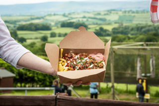 An image of pulled pork, slaw and fries with the glorious view you can enjoy whilst you're eating behind.