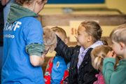 An image of children stroking a bunny.